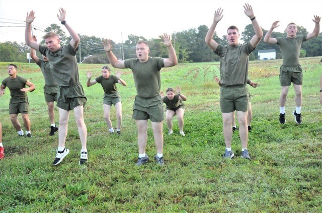Marines perform warmup exercises prior to the annual Lt. Gen. Lewis Burwell “Chesty” Puller Run Oct. 13 in Saluda, Virginia. In previous years, the tribute started with a physically demanding, 66-mile relay run to the village that is located roughly 66 miles northeast of Fort Lee, and the Marines ran in formation for the final four miles. Last year’s tighter COVID restrictions would only permit a gravesite ceremony in dress-blue uniform. The four-mile run returned for the 28th iteration. (U.S. Army photo by T. Anthony Bell)