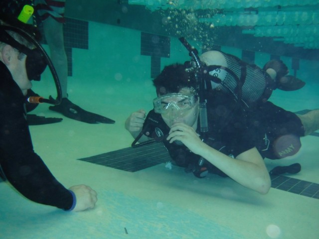 On July 15, Juan Carrasco (left) and Spc. Joseph Suarez (right) posed for a photo during an Intro to Scuba class at the Magrath Gym offered by the Fort Drum Soldier Recovery Unit, New York. (Photo courtesy of Sgt. Joyce Blanco Paredes)