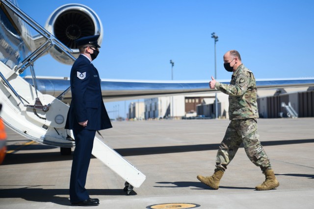 General Stephen R. Lyons, U.S. Transportation Command commander prepares to board a C-37 Gulfstream Mar. 4, 2021 at McConnell Air Force Base, Kansas. Lyons visited Team McConnell to be briefed on current tanker operations with the KC-135 Stratotanker and the KC-46 Pegasus. (U.S. Air Force photo by Airman 1st Class Zachary Willis)