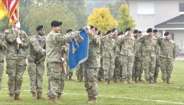 Lt. Col.  Christian Gregoire and Command Sgt. Maj. Kenneth Farley prepare the 522nd Military Intelligence Battalion Colors for casing. The ceremony was held Oct. 15, 2021 at Clay Kaserne in Wiesbaden, Germany.