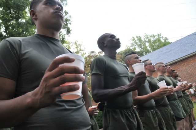 Marines prepare to toast while listening to speeches about Lt. Gen. Lewis Burwell “Chesty” Puller at Christ Church Parish Cemetery following a four-mile run event Oct. 13 to honor the Marine icon.