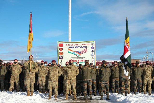 U.S. paratroopers with the 4th Infantry Brigade Combat Team (Airborne), 25th Infantry Division, “Spartan Brigade,” and Indian Army troops from 7th Battalion, The Madras Regiment, “Shandaar Saath,” pose for a group photo during an opening ceremony for exercise Yudh Abhyas 21 Oct., 15, 2021, at Joint Base Elmendorf-Richardson, Alaska. Approximately 350 Indian Army troops and 400 U.S. paratroopers will participate in the two-week training event and learn to work together in Alaska’s unique environment. (U.S. Army photo by Staff Sgt. Alexander Skripnichuk)