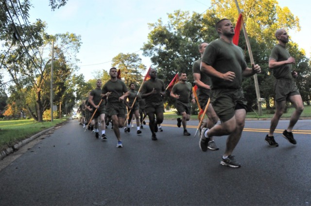 Military personnel from Marine Detachment, led by Capt. Norman Bunch, start out toward Christ Church Parish (Episcopal) during the annual Lt. Gen. Lewis Burwell “Chesty” Puller Run Oct. 13. The Marines started the formation run in Saluda where...