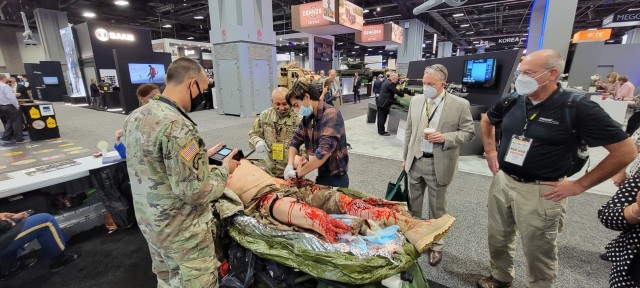The U.S. Army Medical Center of Excellence, or MEDCoE, provided a participatory experience for attendees during the Association of the United States Army’s, or AUSA’s, Annual Meeting, October 11-13. Hundreds of Army senior leaders, industry leaders and other interested AUSA participants stopped by the MEDCoE kiosk for a fully interactive demonstration that highlighted the Tactical Combat Casualty Care Exportable, or TC3X, mannequin, offering an opportunity to see the simulation capabilities in action during live, hands-on exhibitions. The demonstrations were led by Master Sgt. Rodel Gonzalez, Senior Enlisted Medical Simulation and Training Materiel Capability Developer, Program Executive Office, Simulation Training and Instrumentation, Medical Simulation; James Kinser, Medical Simulation Modernization and Technology Program Lead, Directorate of Simulation, MEDCoE; and Master Sgt. Kaleb Twilligear, Noncommissioned Officer in Charge, Directorate of Simulation, MEDCoE.