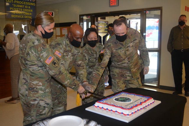 (From left) Lt. Col. Christina Rivas, commander, Army Field Support Battalion-Korea; Col. Lisa Rennard, commander, 403rd Army Field Support Brigade; Brig. Gen. Joseph D’costa, deputy commanding general - sustainment, Eighth Army; and Col. Seth Graves, commander, U.S. Army Garrison-Humphreys, cut the ceremonial cake following the AFSBn-Korea SPT060 complex grand opening and ribbon cutting ceremony at Camp Humphreys, South Korea, Oct. 14.