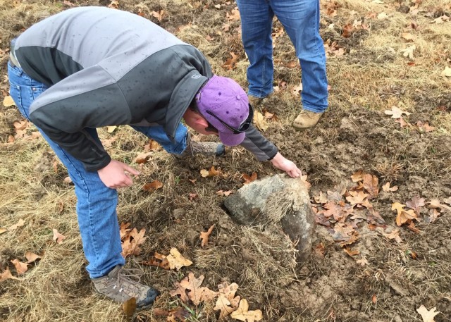 A grave marker damaged by feral hogs at Fort Leonard Wood’s Bloodland Cemetery is noted by personnel from the Directorate of Public Works. Due to their destructive potential, Fort Leonard Wood contracts with USDA Wildlife Services to provide a...