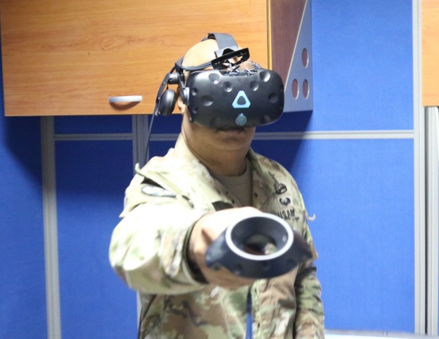 Chief Warrant Officer 3 Eric Stewart, with the 29th Infantry Division, conducts counter-unmanned aerial system training on a SPECTRE virtual reality simulator at Camp Buehring, Kuwait.