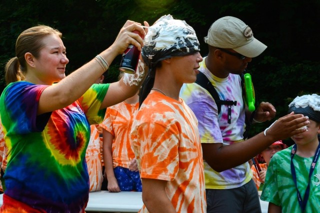 Camp counselors Tina Zabierek and Joshua Hudson, both members of the Maine National Guard, lead an activity at the Maine National Guard's youth camp in Gilead, Maine, July 13, 2014. This is the 16th annual youth camp, which is designed to...