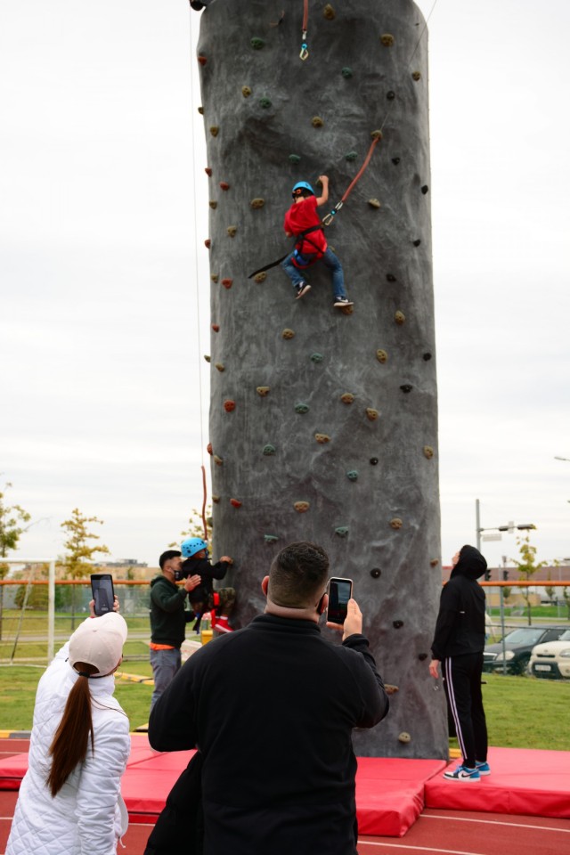 Military Families try the climbing wall at the Humphreys Festival Oct.16, 2021. Service members, Families and community members gathered together to celebrate the season through family-friendly activities, performances, and food. (U.S. Army photo...