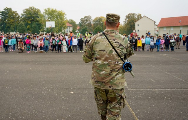 Lt. Col. Jon Jackson, provost marshal of the directorate of emergency services speaks to students at Aukamm Elementary after an afternoon fire drill, Oct. 18, 2021. Jackson recognized 5th grader Olivia Briggs for her quick call to emergency services, preventing further fire danger at a nearby residence.