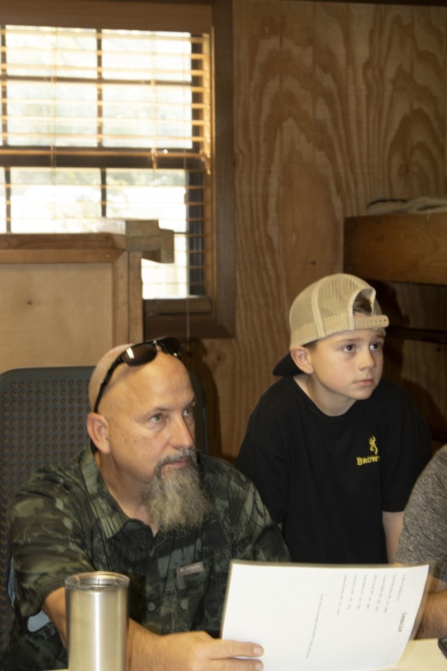 David Hawkins and his nine year old nephew Eli study a map of the designated hunting area prior to heading out for Hugo's 1st hunt of the 2021 season.  The hunt is held annually in conjunction with the Oklahoma Department of Wildlife's hunt. ...