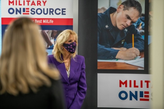 First Lady Dr. Jill Biden listens to a facilitator from Military OneSource during a tour in Arlington, Va., April 7, 2021.