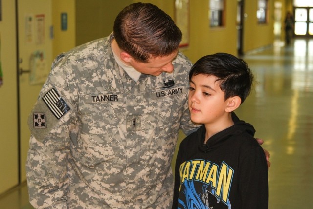 Army Chief Warrant Officer 2 Brandon Tanner, a maintenance technician with the 602nd Aviation Support Battalion, 2nd Combat Aviation Brigade, congratulates his son, Nathan, at Humphreys Central Elementary School on Camp Humphreys in South Korea, April 1, 2015. Nathan competed in the school&#39;s first spelling bee.