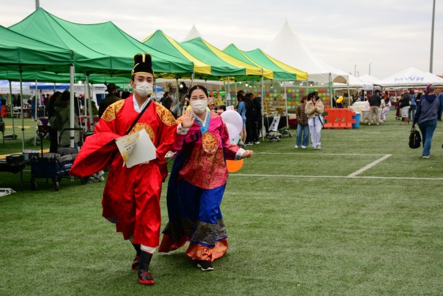 The Camp Humphreys community gathers on Balboni Field to share seasonal fall festivities at the Humphreys Festival Oct.16, 2021. Service members, Families and community members gathered together to celebrate the season through family-friendly...