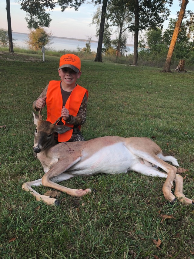 Easton Cheatwood, age 9 from Prague, OK, brings in the first deer on Friday evening.