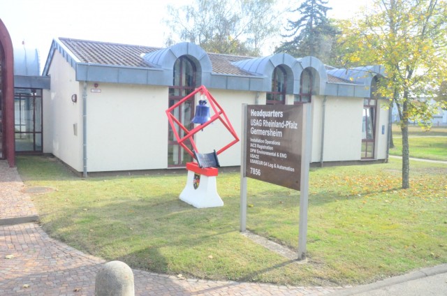 A &#34;70 Years&#34; commemorative plaque and refurbished bell from the former chapel at GAD mark the entrance of the current site&#39;s garrison headquarters.