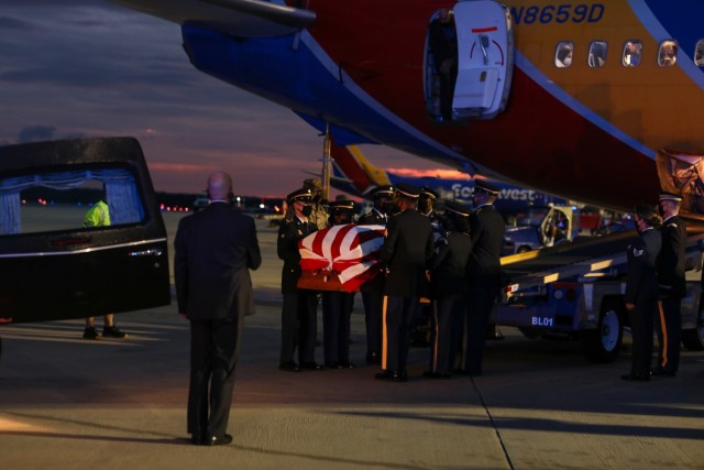 Soldiers with the North Carolina National Guard’s (NCNG) Military Funeral Honors Team transfer the remains of 1st Lt. James E. Wright, at the Raleigh-Durham International Airport, in Morrisville, North Carolina, Oct. 8, 2021. Wright, who had served with the NCNG’s 120th Infantry Regiment, was killed in action in the vicinity of Dornot, France on Sept. 10, 1944. Wright was previously listed as missing in action until recently when his remains were identified through DNA testing. (U.S. Army Photo by Sgt. 1st Class Mary Junell)