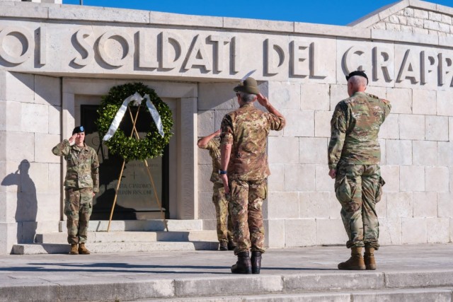 Col. Scott P. Noon, the U.S. Army Southern European Task Force, Africa G4 director of logistics, right, and Col. Michele Biasiutti, the U.S. Army Garrison Italy senior Italian officer, second from right, salute during a wreath-laying ceremony at...