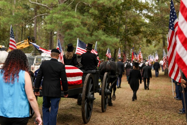 A funeral caisson carries the remains of 1st Lt. James E. Wright one mile in a procession from the Lumber Bridge Baptist Church to the Oakdale Cemetery in Lumber Bridge, North Carolina on Oct. 12, 2021. Wright, who had served with the NCNG’s 120th Infantry Regiment and grew up in Lumber Bridge, was killed in action in the vicinity of Dornot, France on Sept. 10, 1944. Wright was previously listed as missing in action until recently when his remains were identified through DNA testing. (U.S. Army Photo by Sgt. 1st Class Mary Junell)