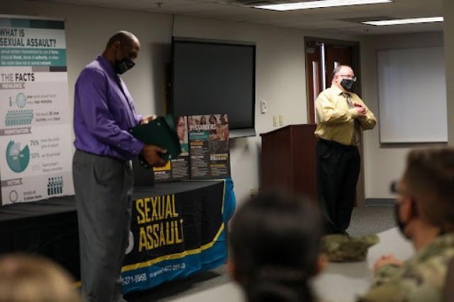 Robert Lewis, right, the 3rd Infantry Division's Sexual Harassment Assault Response Prevention program manager, and Rodger Taylor, the 3rd Infantry Division SHARP instructor, present Marne Guardian graduation certificates on Fort Stewart, Georgia, Oct.15, 2021. The Marne Guardian program is a new initiative under the division’s Marne Steady program, which focuses on building a community of belonging based on trust, pride, shared values and respect. (U.S. Army photo by Pfc. Elsi Delgado)