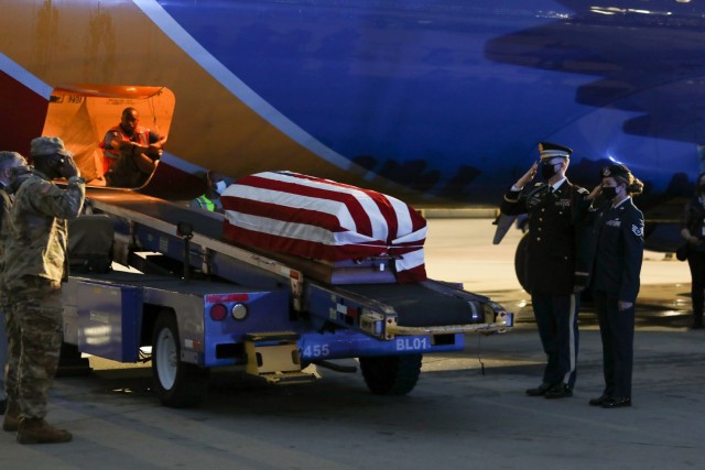 Soldiers with the North Carolina National Guard’s (NCNG) Military Funeral Honors Team transfer the remains of 1st Lt. James E. Wright, at the Raleigh-Durham International Airport, in Morrisville, North Carolina, Oct. 8, 2021. Wright, who had...