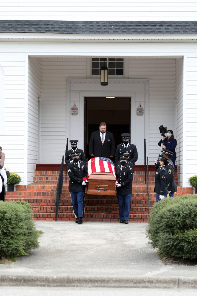 Soldiers with the North Carolina National Guard’s Military Funeral Honors transfer the remains of 1st Lt. James E. Wright from the Lumber Bridge Baptist Church to a funeral caisson in Lumber Bridge, North Carolina on Oct. 12, 2021. Wright, who had served with the NCNG’s 120th Infantry Regiment and grew up in Lumber Bridge, was killed in action in the vicinity of Dornot, France on Sept. 10, 1944. Wright was previously listed as missing in action until recently when his remains were identified through DNA testing. (U.S. Army Photo by Sgt. 1st Class Mary Junell)