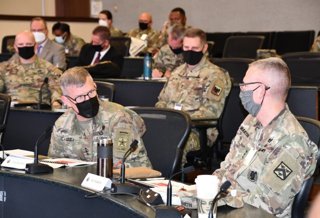 Lt. Gen. James Rainey (left), Deputy Chief of Staff, Department of the Army G-3/5/7, makes opening remarks during day three of the Mission Command Network Summit, Oct. 20, at Fort Leavenworth, Kan. Hosted by Lt. Gen. Theodore Martin (right), Combined Arms Center commanding general, the summit brings together leaders from across the Army to discuss specific near-term Army network and Mission Partner Environment challenges.