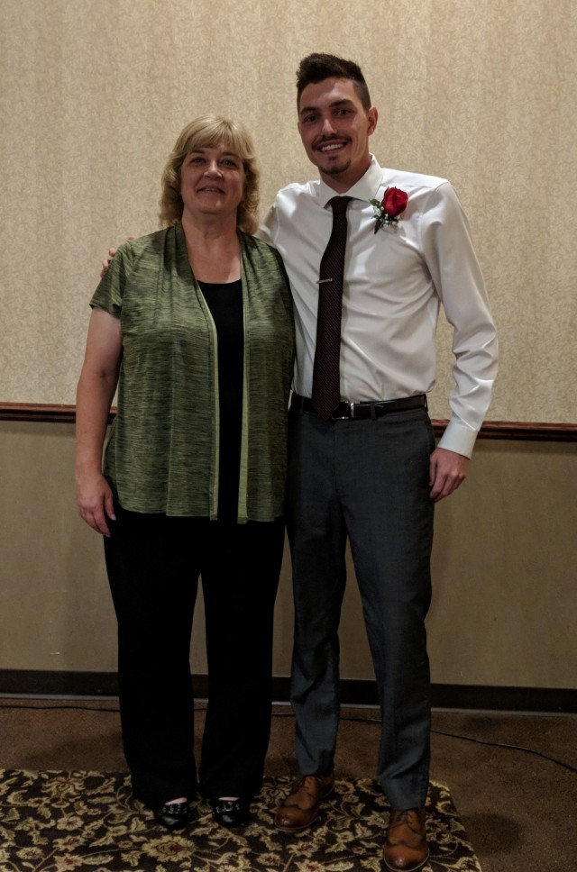Janet Laufenberg, human resource specialist, 1st Theater Sustainment Command, and her son Colin celebrate his graduation from Magnetic Resonance Imaging school in Wisconsin. Laufenberg joined the First Team in November 2020. (courtesy photo)