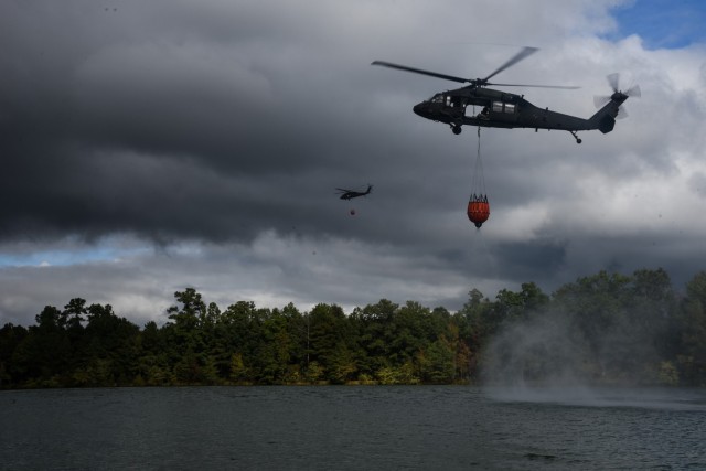 Virginia Army National Guard flight crews conduct water bucket training with UH-60 Black Hawk helicopters Oct. 12, 2021, at a training area in Chesterfield, Virginia. These Soldiers are scheduled to deploy to Kosovo with the 2nd Battalion, 224th...