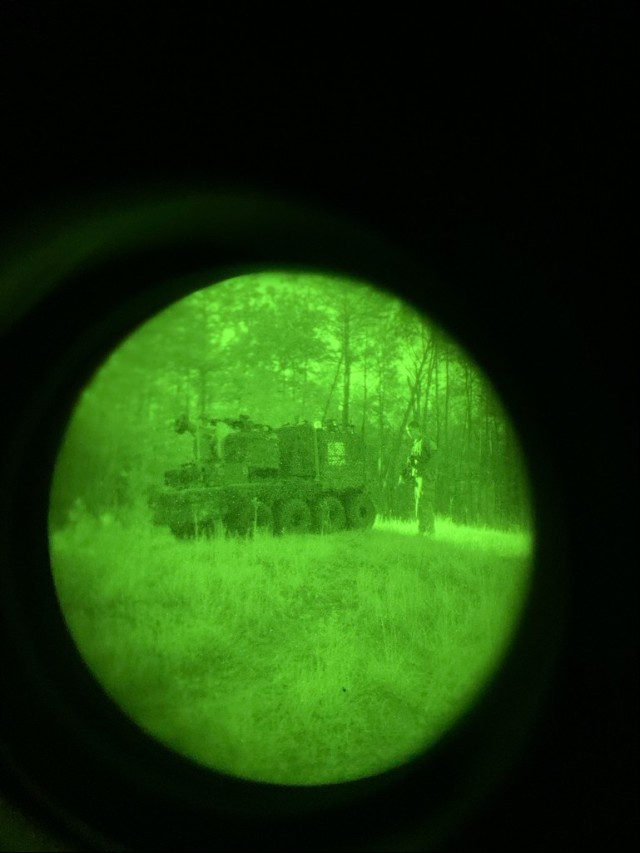 The Project Origin vehicle, a surrogate for Army Robotic Combat Vehicles, is seen through a night vision lens at the Joint Readiness Training Center at Fort Polk, Louisiana, in September 2021.