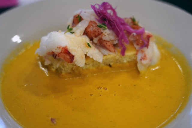 An appetizer of lobster bisque, southern cornbread, butter-poached lobster, and pickled red cabbage, prepared by Sgt. Tashauna Walls and Spc. Nhien Nguyen, Field Feeding Platoon, 35th Combat Sustainment Support Battalion, 10th Support Group. The...