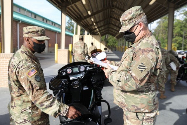 Master Sgt. Dereck Souder (left) the maintenance manager of 87th Division Sustainment Support Battalion, 3rd Division Sustainment Brigade, 3rd Infantry Division, and Sgt. 1st Class Daniel Anderson (right) the 87th DSSB primary motorcycle mentor,...
