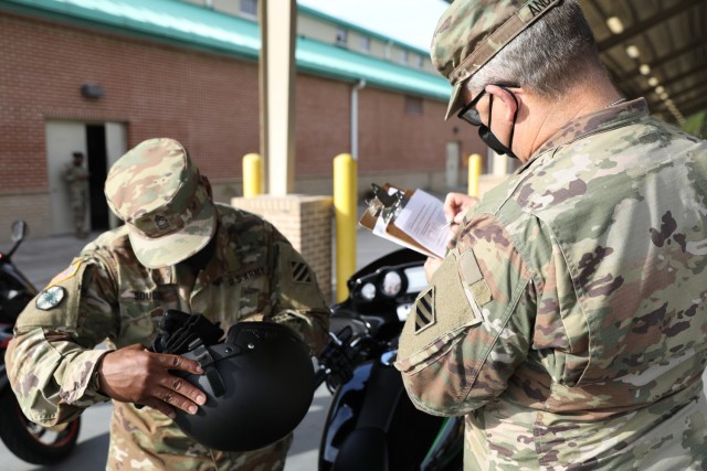 Master Sgt. Dereck Souder (left) the maintenance manager of 87th Division Sustainment Support Battalion, 3rd Division Sustainment Brigade, 3rd Infantry Division, and Sgt. 1st Class Daniel Anderson (right) the 87th DSSB primary motorcycle mentor,...