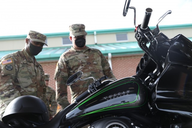 Master Sgt. Dereck Souder (left) the maintenance manager of 87th Division Sustainment Support Battalion, 3rd Division Sustainment Brigade, 3rd Infantry Division, and Sgt. 1st Class Daniel Anderson (right) the 87th DSSB primary motorcycle mentor,...