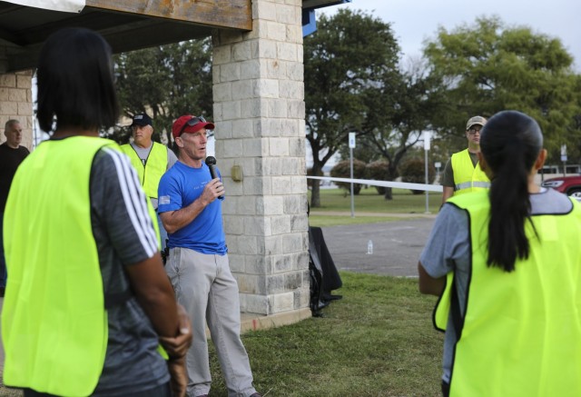 III Corps and Fort Hood leaders, Soldiers, Association of the U.S. Army (AUSA) and community members gathered near T.J. Mills Bernie Beck main gate to assist with trash cleanup, at Fort Hood, Texas Oct. 23, 2021. With over 50 participants, the event’s goal is to increase the partnership between Soldiers and the local community through mentorship which is apart of the AUSA's Professional Mentor Program which offers professional development forums to enhance military careers and helps strengthen the relationship between Soldiers and the local community. (U.S. Army photo by Sgt. Melissa N. Lessard)