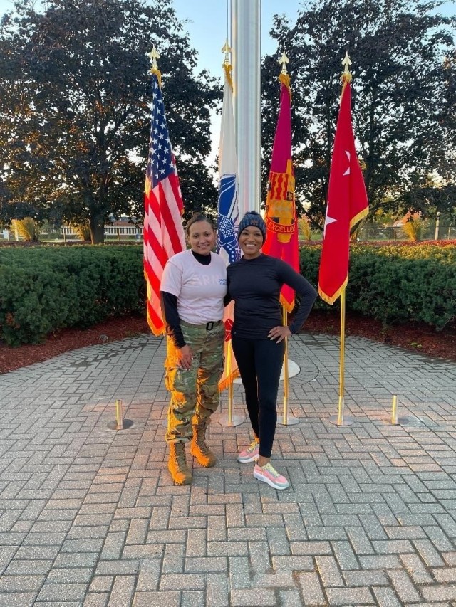 Master Sgt. Fransheska Wiggins, Detroit Arsenal Breast Cancer Awareness Month co-coordinator, poses with Jacqueline “Jack” Howard, guest speaker for the event, at the Detroit Arsenal, Michigan flag pole after the Ruck/Walk/Run event Oct. 18. (Photo by Master Sgt. Christopher Jackson)