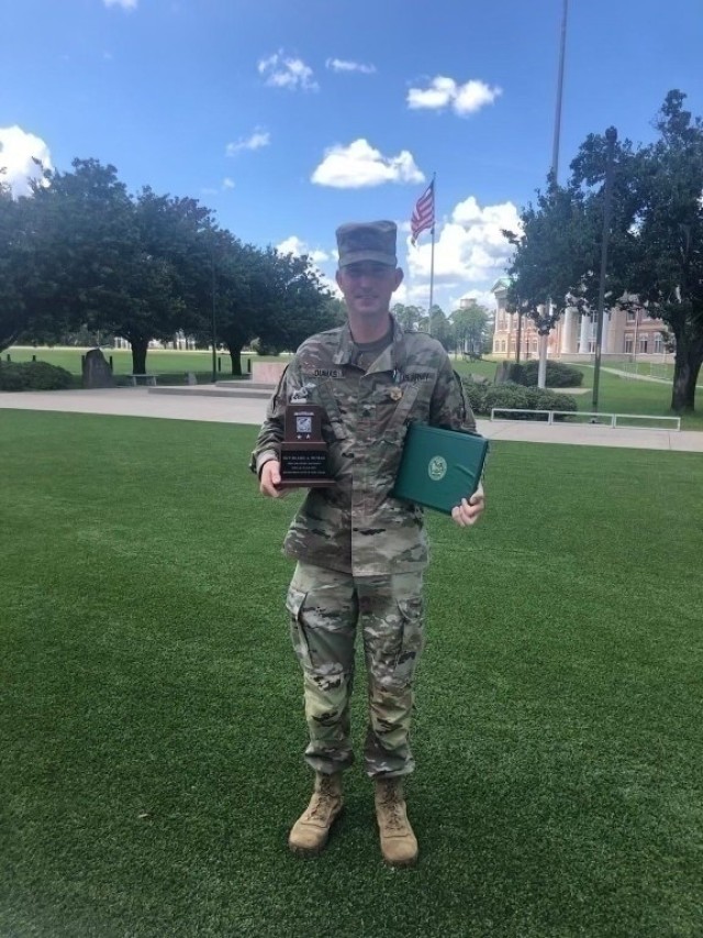 Sgt. Blake Dumas, assigned to the 6th Squadron, 8th Cavalry Regiment, 2nd Armor Brigade Combat Team, 3rd Infantry Division, is given an award for the 3rd ID Retention Noncommissioned Officer of the Year at Fort Stewart, Georgia, Aug. 2, 2021....