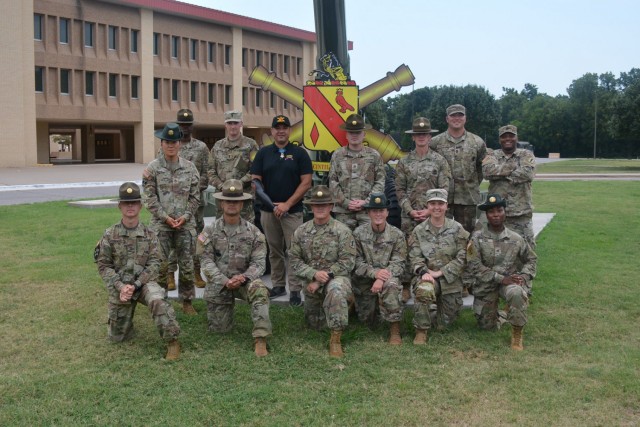 At the request of Medal of Honor recipient and retired Master Sgt. Leroy Petry, 1st Lt. Vira Miller joins a group photo with drill sergeants and cadre from 1st Battalion, 19th Field Artillery in August at Fort Sill, Oklahoma. Petry was the guest speaker for a Basic Combat Training graduation Aug. 20, 2021. (U.S. Army photo by Capt. Eric Seitz)