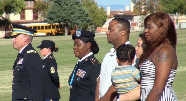 Master Sgt. Esther Spears and family stand on  Brown Parade Field as the Soldier retires after 25 years of military service at a ceremony on Fort Huachuca, Ariz. 