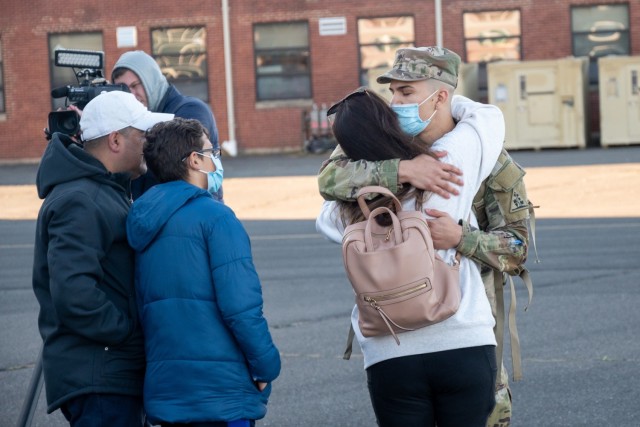 A Soldier assigned to the 142nd Medical Company kisses a loved one at the Army Aviation Support Facility in Windsor Locks, Conn. on Oct. 24, 2021. The unit was mobilizing in support of Operation Atlantic Resolve and heading to Texas before...