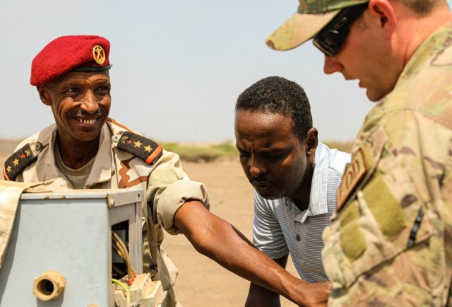 Capt. Le Mohamed Louaita, commander for Djiboutian Demining Co. expresses gratitude to Tech. Sgt. Dylan Wagner, explosive ordnance disposal technician, 123rd Airlift Wing during verbal exchange on August 22, 2021 in Djibouti City,...