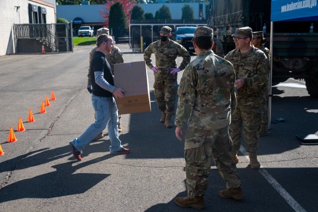 Soldiers from the Connecticut National Guard assist members of the Drug Enforcement Agency collect boxes of prescription drugs that were turned in to local police departments as part of National Prescription Drug Take Back Day Oct. 23-24, 2021 in Rocky Hill, Connecticut. This nationwide event was created by the DEA to help dispose of old, expired, or unwanted drugs in order to help reduce the possibility of their misuse.