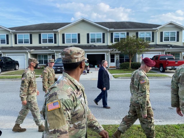 Doug Delzeith (center), Directorate of Public Works Housing Division, walks with Hunter Army Airfield leaders through Hunter Ridge housing area during town hall, Oct. 14. Leaders from Hunter Army Airfield Garrison, Directorate of Emergency Services, Directorate of Public Works, Army Housing and Balfour Beatty attended the event for leaders and community members to ask questions.