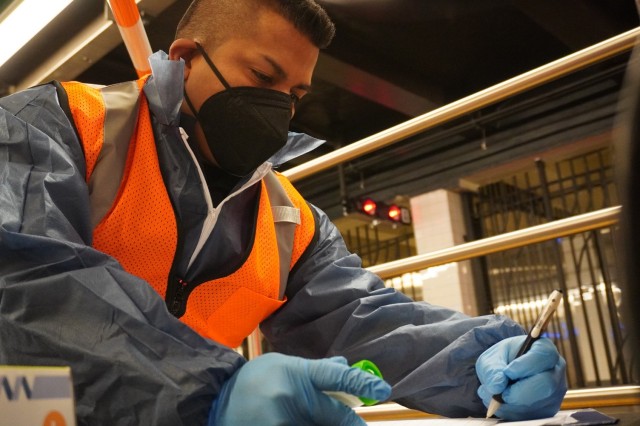 New York Army National Guard Staff Sgt Jonathan Vasconez, a member of the New York National Guard's 24th Civil Support Team, takes notes while collecting data at a testing location in the World Trade Center Subway Station in New York City Oct....