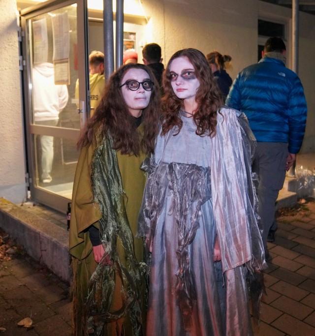 Two volunteer guides stand in front of the entrance to the "Ansbach House of Terror" Oct. 23, 2021 (Rosalie Hodges, right; Clara Hodges, left)
