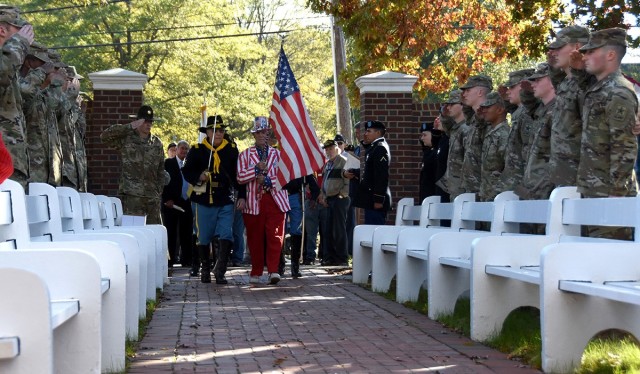 Soldiers flank the aisle saluting those who have served before them during a procession at a Veterans Day event on the Courthouse Green in Chesterfield County Nov. 11.  The event was attended by more than 200 people, including veterans from every war since World War II. 