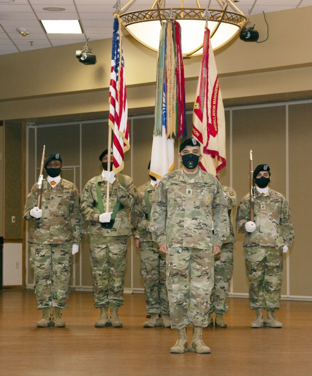 Garrison Command Sgt. Maj. R. Cesar Duran stands before the unit colors at the end of the Garrison change of responsibility ceremony Oct. 27.