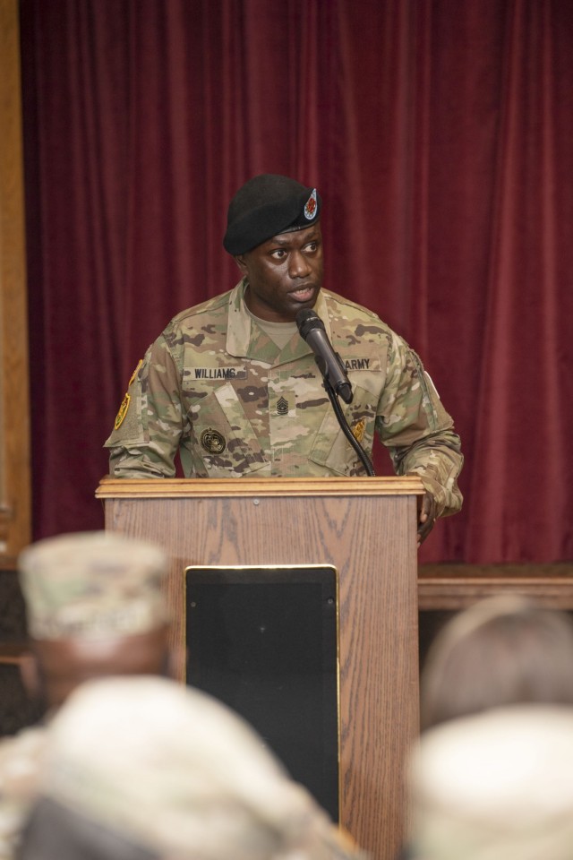 Command Sgt. Maj. Algrish Williams, outgoing garrison sergeant major, speaks during the change of responsibilty ceremony where he relinquished responsibility of the unit to Garrison Command Sgt. Maj. R. Cesar Duran.