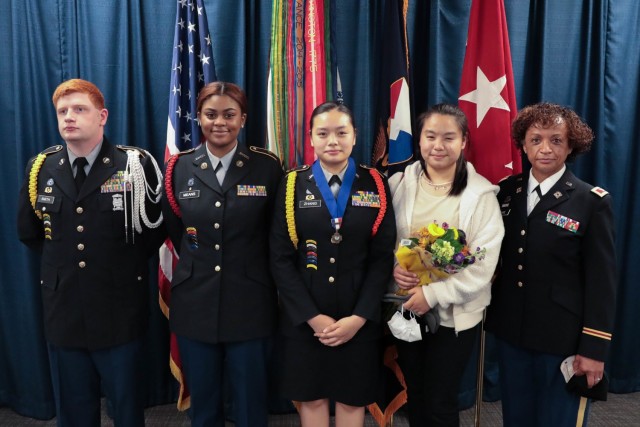 Lee/New Century Technology High School JROTC Cadet Lt. Col. Weixing Zhang with her sister Weilan Zhan; mentor and coach, JROTC senior instructor retired Col. Diane Richie; and two fellow Lee/New Century JROTC cadets following an Oct. 27 award presentation at Army Materiel Command headquarters where Weixing received the Legion of Valor Bronze Cross for Achievement. She is the second JROTC battalion commander from Lee/New Century Technology High School to receive the prestigious award. For more photos, visit AMC&#39;s Flickr album:  https://flic.kr/s/aHsmX2D7rK. 