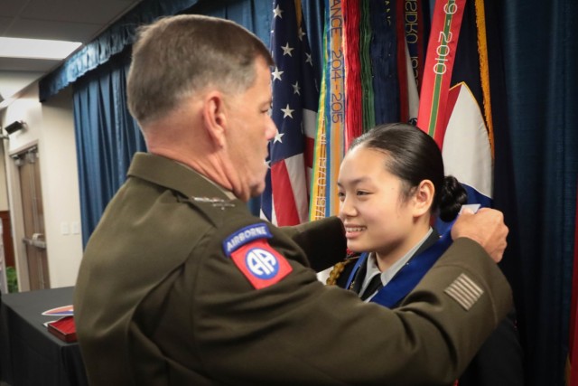 Army Materiel Command Deputy Commanding General Lt. Gen. Donnie Walker presents  Lee/New Century Technology High School JROTC Cadet Lt. Col. Weixing Zhang with the Legion of Valor Bronze Cross for Achievement during an Oct. 27 award presentation at AMC headquarters. He also presented her with a three-star note commending her on the accomplishment. For more photos, visit the AMC Flickr album: https://flic.kr/s/aHsmX2D7rK . 